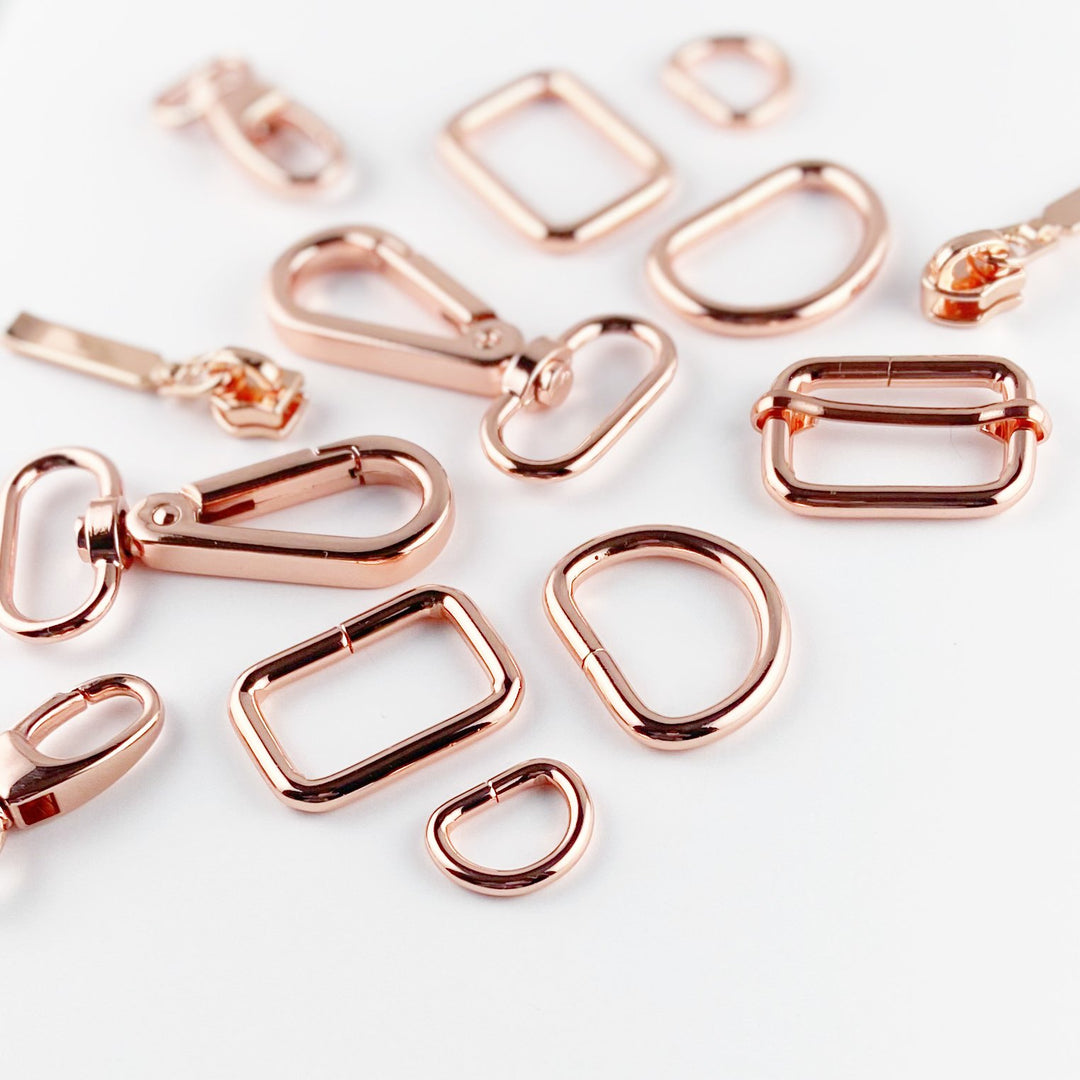 Bag making hardware — D-rings, swivel hooks, sliders, and rings in silver, bronze, and rose gold