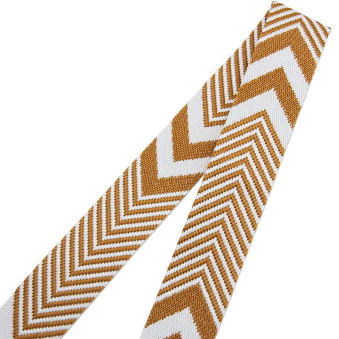 Woven webbing with chevron pattern in brown and white on a white background